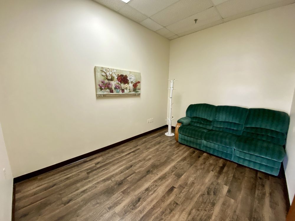 The shop waiting area with green seating